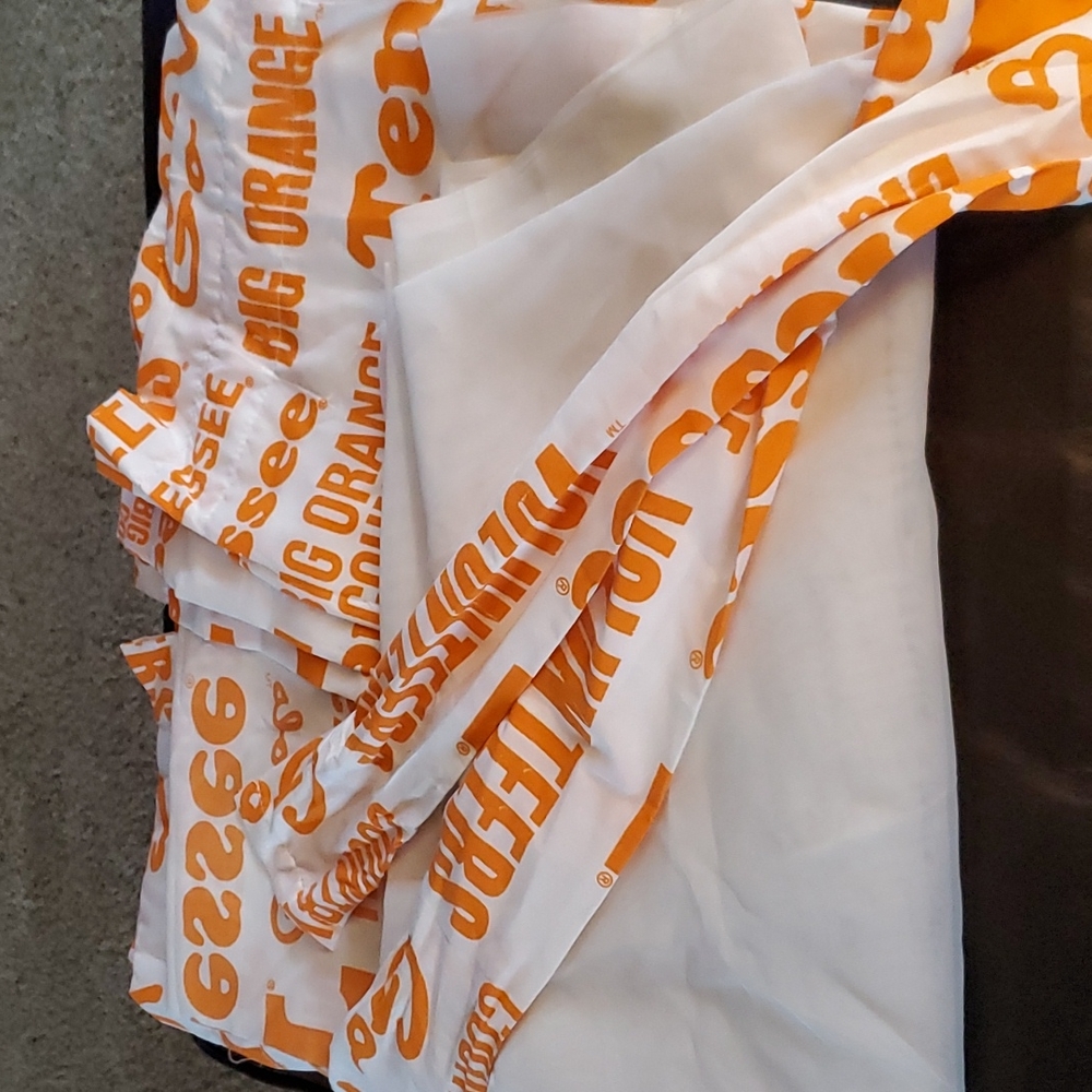 University of Tennessee curtains with white shear panel and tie backs.